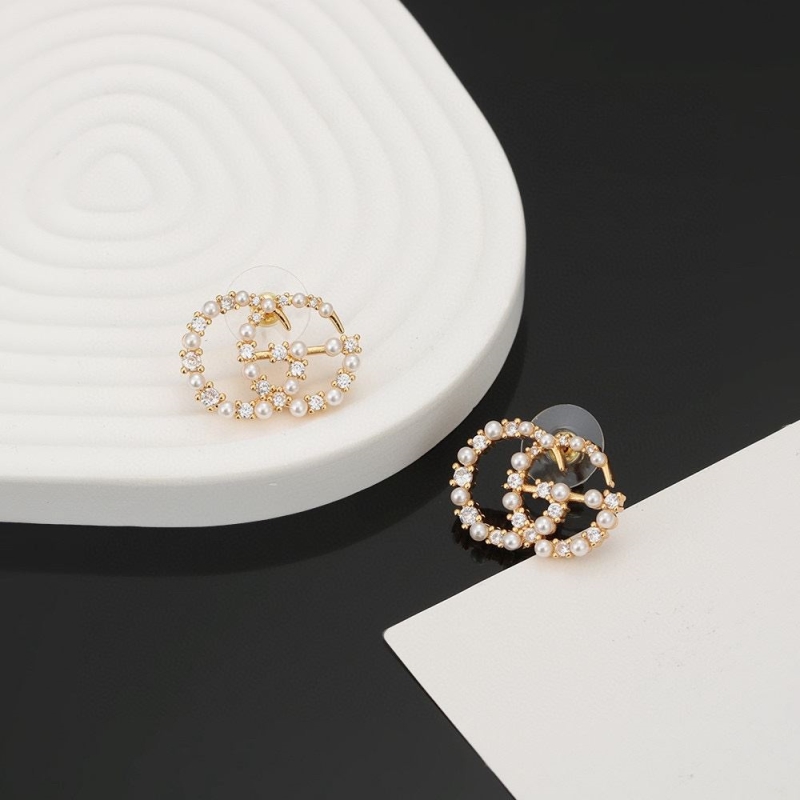 G*u*i earrings